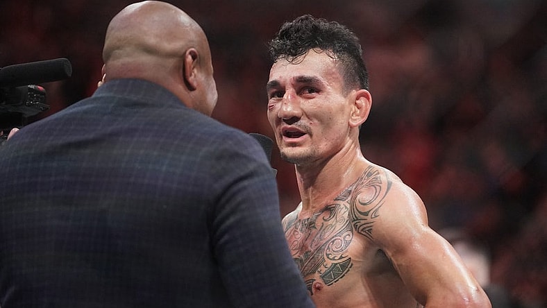 Apr 15, 2023; Kansas City, Missouri, USA; Max Holloway (red gloves) reacts after the fight against Arnold Allen (blue gloves) during UFC Fight Night at T-Mobile Center. Mandatory Credit: Denny Medley-USA TODAY Sports