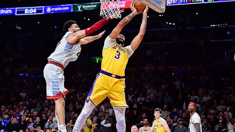 May 22, 2023; Los Angeles, California, USA; Los Angeles Lakers forward Anthony Davis (3) is fouled by Denver Nuggets guard Jamal Murray (27) during the fourth quarter in game four of the Western Conference Finals for the 2023 NBA playoffs at Crypto.com Arena. Mandatory Credit: Gary A. Vasquez-USA TODAY Sports