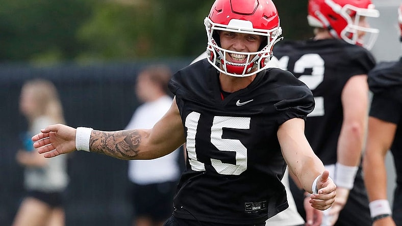 Georgia quarterback Carson Beck (15) reacts during the first day fall football camp in Athens, Ga., on Thursday, Aug. 3, 2023.