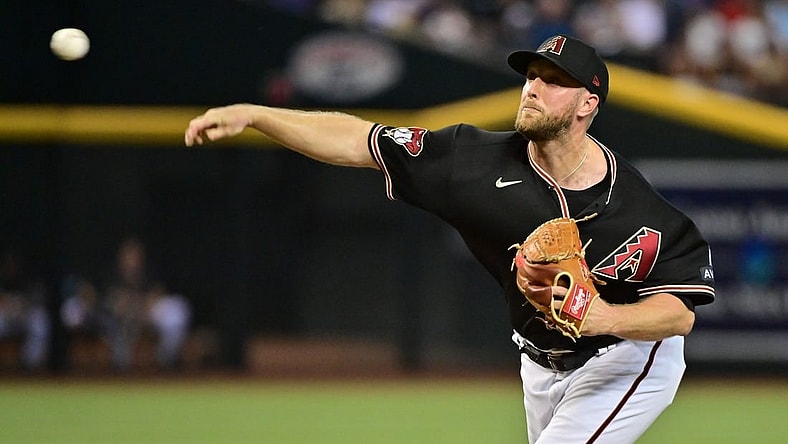 Aug 9, 2023; Phoenix, Arizona, USA;  Arizona Diamondbacks starting pitcher Merrill Kelly (29) throws in the first inning against the Los Angeles Dodgers at Chase Field. Mandatory Credit: Matt Kartozian-USA TODAY Sports