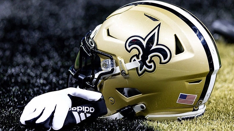 Aug 13, 2023; New Orleans, Louisiana, USA;  Detailed view of the New Orleans Saints helmet and glove during pregame against the Kansas City Chiefs at the Caesars Superdome. Mandatory Credit: Stephen Lew-USA TODAY Sports