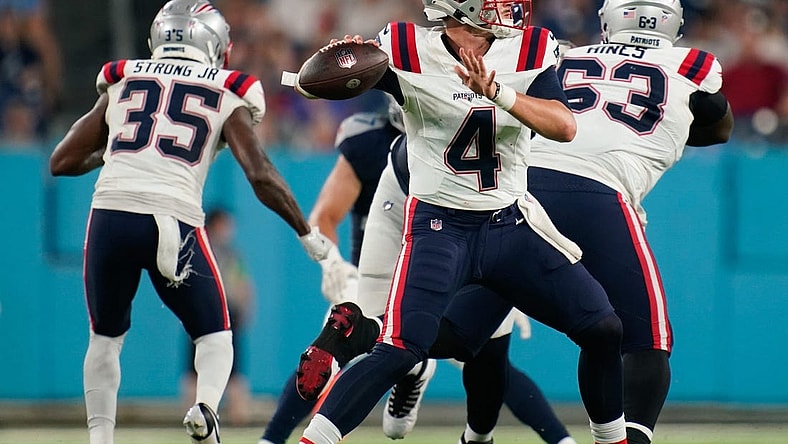 New England Patriots quarterback Bailey Zappe (4) throws a pass during the third quarter at Nissan Stadium in Nashville, Tenn., Friday, Aug. 25, 2023.