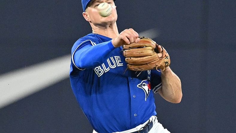 Aug 26, 2023; Toronto, Ontario, CAN;  Toronto Blue Jays third baseman Matt Chapman (26) throws to retire Cleveland Guardians left fielder Oscar Gonzalez (not shown) in the fourth inning at Rogers Centre. Mandatory Credit: Dan Hamilton-USA TODAY Sports
