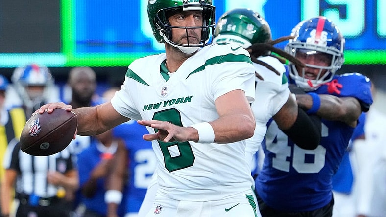 Aug 26, 2023; East Rutherford, New Jersey, USA;   New York Jets quarterback Aaron Rodgers (8) throws against the Giants at MetLife Stadium. Mandatory Credit: Robert Deutsch-USA TODAY Sports