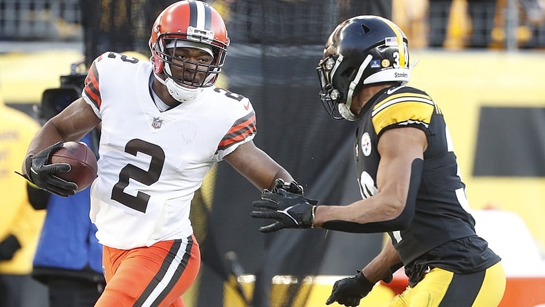 Jan 8, 2023; Pittsburgh, Pennsylvania, USA;  Cleveland Browns wide receiver Amari Cooper (2) runs after a catch as Pittsburgh Steelers safety Minkah Fitzpatrick (39) chases during the fourth quarter at Acrisure Stadium. Pittsburgh won 28-14. Mandatory Credit: Charles LeClaire-USA TODAY Sports
