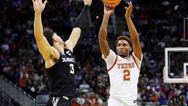 Mar 24, 2023; Kansas City, MO, USA; Texas Longhorns guard Arterio Morris (2) shoots against Xavier Musketeers guard Colby Jones (3) during the first half of an NCAA tournament Midwest Regional semifinal at T-Mobile Center. Mandatory Credit: Jay Biggerstaff-USA TODAY Sports