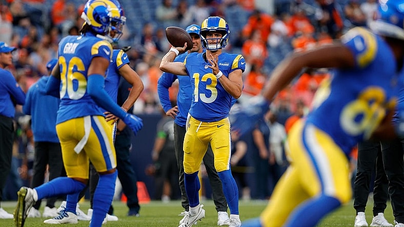 Aug 26, 2023; Denver, Colorado, USA; Los Angeles Rams quarterback Stetson Bennett (13) warms up before the game against the Denver Broncos at Empower Field at Mile High. Mandatory Credit: Isaiah J. Downing-USA TODAY Sports