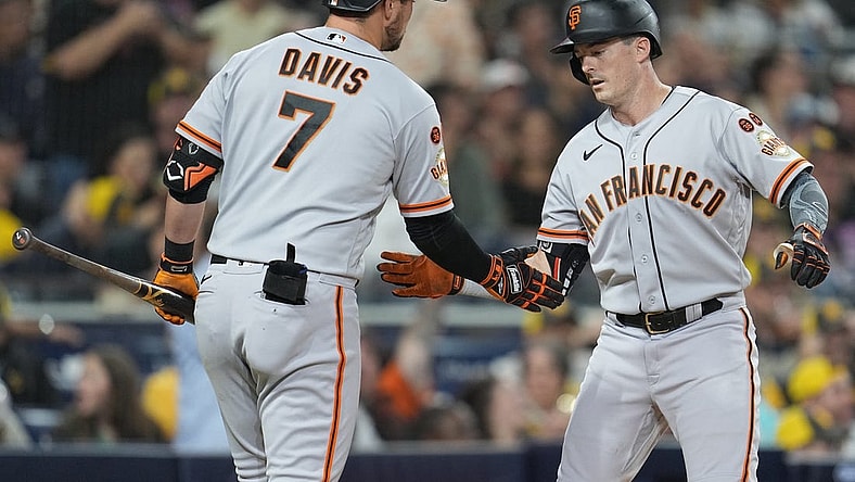 Aug 31, 2023; San Diego, California, USA; San Francisco Giants right fielder Mike Yastrzemski (right) is congratulated by third baseman J.D. Davis (7) after hitting a home run against the San Diego Padres during the fifth inning at Petco Park. Mandatory Credit: Ray Acevedo-USA TODAY Sports