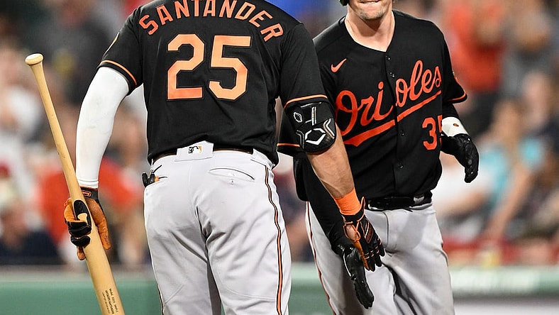 Sep 8, 2023; Boston, Massachusetts, USA; Baltimore Orioles catcher Adley Rutschman (35) high-fives right fielder Anthony Santander (25) after hitting a home run against the Boston Red Sox during the eighth inning at Fenway Park. Mandatory Credit: Brian Fluharty-USA TODAY Sports