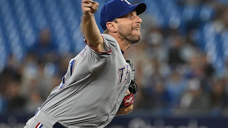 Sep 12, 2023; Toronto, Ontario, CAN;   Texas Rangers starting pitcher Max Scherzer (31) delivers a pitch against the Toronto Blue Jays in the first inning at Rogers Centre. Mandatory Credit: Dan Hamilton-USA TODAY Sports