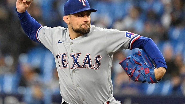 Sep 14, 2023; Toronto, Ontario, CAN;   Texas Rangers starting pitcher Nathan Eovaldi (17) delivers a pitch against the Toronto Blue Jays in the first inning at Rogers Centre. Mandatory Credit: Dan Hamilton-USA TODAY Sports