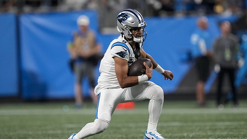 Sep 18, 2023; Charlotte, North Carolina, USA; Carolina Panthers quarterback Bryce Young (9) keeps the ball running out of the pocket against the New Orleans Saints during the second half at Bank of America Stadium. Mandatory Credit: Jim Dedmon-USA TODAY Sports