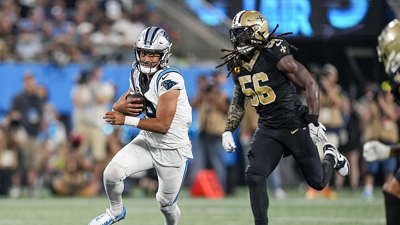 Sep 18, 2023; Charlotte, North Carolina, USA; New Orleans Saints linebacker Demario Davis (56) chases Carolina Panthers quarterback Bryce Young (9) during the second half at Bank of America Stadium. Mandatory Credit: Jim Dedmon-USA TODAY Sports