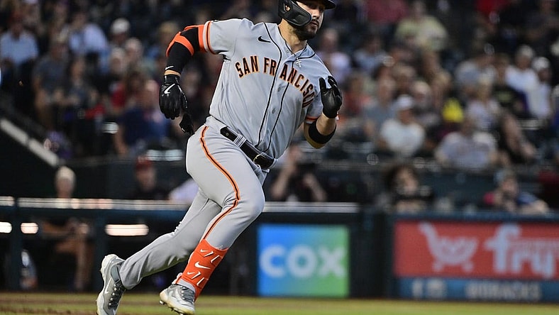 Sep 20, 2023; Phoenix, Arizona, USA;  San Francisco Giants right fielder Michael Conforto (8) runs after hitting a double in the second inning against the Arizona Diamondbacks at Chase Field. Mandatory Credit: Matt Kartozian-USA TODAY Sports