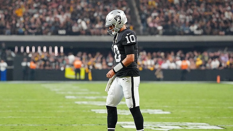 Sep 24, 2023; Paradise, Nevada, USA; Las Vegas Raiders quarterback Jimmy Garoppolo (10) walks back to the huddle after being knocked to the ground by the Pittsburgh Steelers defense during the fourth quarter at Allegiant Stadium. Mandatory Credit: Stephen R. Sylvanie-USA TODAY Sports