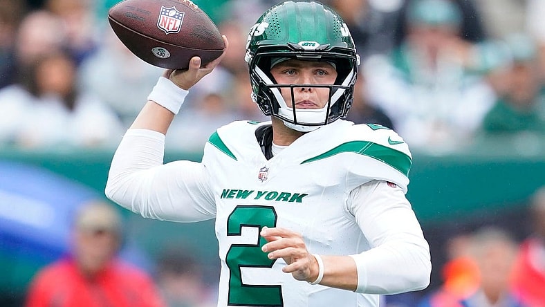 New York Jets quarterback Zach Wilson throws the ball against the New England Patriots in the first half of his team's loss at MetLife Stadium.