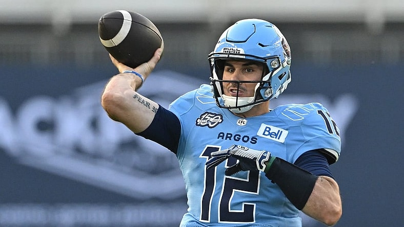 Jun 18, 2023; Toronto, Ontario, CAN; Toronto Argonauts quarterback Chad Kelly (12) throws a pass against the Hamilton Tiger-Cats in the second quarter at BMO Field. Mandatory Credit: Dan Hamilton-USA TODAY Sports