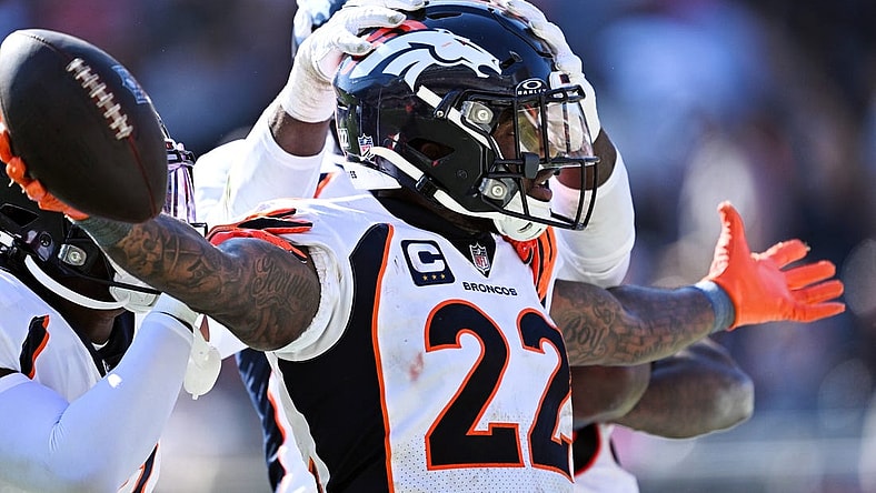 Oct 1, 2023; Chicago, Illinois, USA; Denver Broncos safety Kareem Jackson (22) celebrates after intercepting a Chicago Bears pass in the fourth quarter at Soldier Field. Mandatory Credit: Jamie Sabau-USA TODAY Sports