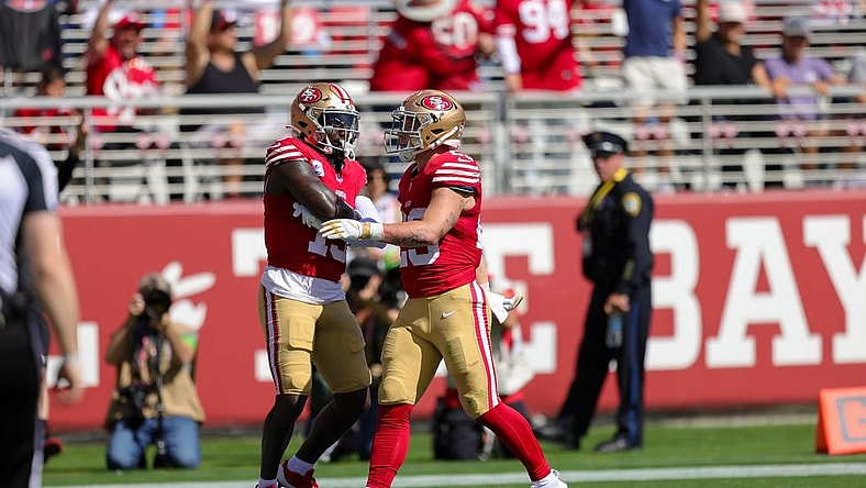 Oct 1, 2023; Santa Clara, California, USA; San Francisco 49ers running back Christian McCaffrey (23) celebrates with wide receiver Deebo Samuel (19) after a scoring a touchdown during the second quarter against the Arizona Cardinals at Levi's Stadium. Mandatory Credit: Sergio Estrada-USA TODAY Sports