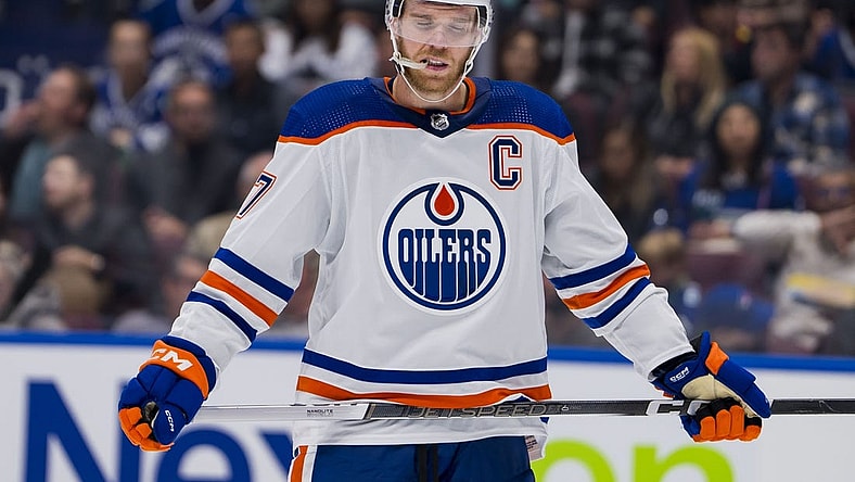 Oct 11, 2023; Vancouver, British Columbia, CAN; Edmonton Oilers forward Connor McDavid (97) reacts to the a goal being scored against the Vancouver Canucks in the second period at Rogers Arena. Mandatory Credit: Bob Frid-USA TODAY Sports