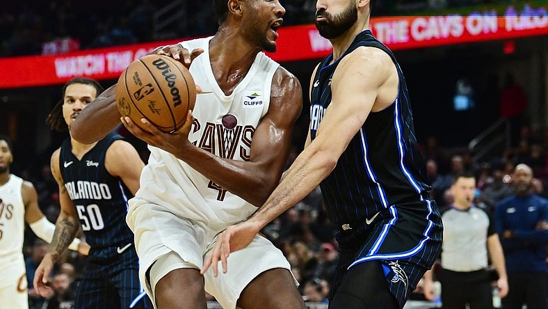 Oct 12, 2023; Cleveland, Ohio, USA; Cleveland Cavaliers forward Evan Mobley (4) drives to the basket against Orlando Magic center Goga Bitadze (35) during the second half at Rocket Mortgage FieldHouse. Mandatory Credit: Ken Blaze-USA TODAY Sports