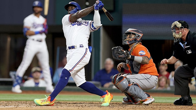 Oct 20, 2023; Arlington, Texas, USA; Texas Rangers right fielder Adolis Garcia (53) hits a three-run home run during the sixth inning of game five in the ALCS against the Houston Astros for the 2023 MLB playoffs at Globe Life Field. Mandatory Credit: Andrew Dieb-USA TODAY Sports