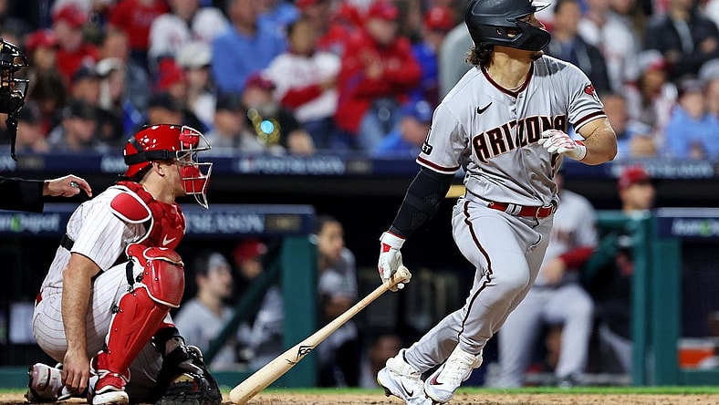 Oct 23, 2023; Philadelphia, Pennsylvania, USA; Arizona Diamondbacks center fielder Alek Thomas (5) hits a single during the sixth inning against the Philadelphia Phillies in game six of the NLCS for the 2023 MLB playoffs at Citizens Bank Park. Mandatory Credit: Bill Streicher-USA TODAY Sports