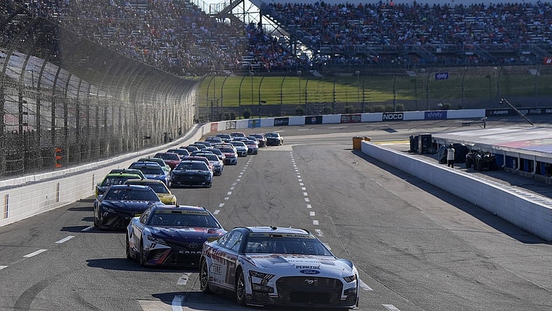 Oct 29, 2023; Martinsville, Virginia, USA; NASCAR Cup Series driver Ryan Blaney (12) leads the pack during the NASCAR Xfinity 500 at Martinsville Speedway. Mandatory Credit: David Yeazell-USA TODAY Sports