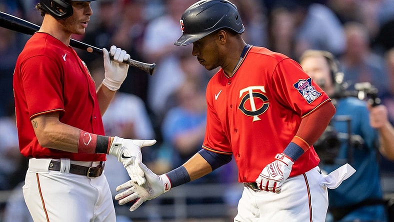 Jun 7, 2022; Minneapolis, Minnesota, USA;  Minnesota Twins right fielder Max Kepler (26) congratulates shortstop Jorge Polanco (11) after scoring against the New York Yankees in the fifth inning at Target Field. Mandatory Credit: Brad Rempel-USA TODAY Sports