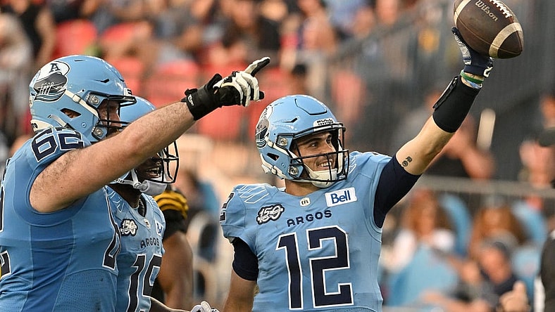 Jun 18, 2023; Toronto, Ontario, CAN; Toronto Argonauts quarter Chad Kelly (2) celebrates after scoring a touchdown against the Hamilton Tiger-Cats in the second quarter at BMO Field. Mandatory Credit: Dan Hamilton-USA TODAY Sports