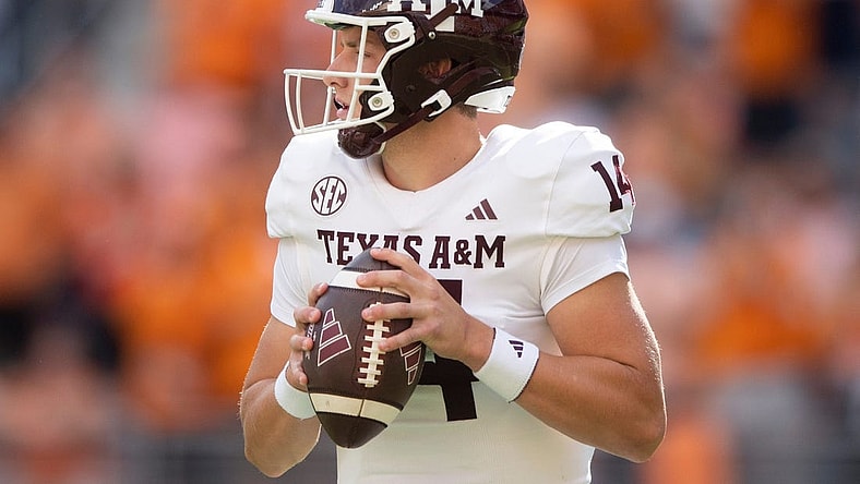 Texas A&M quarterback Max Johnson (14) looks to pass during a football game between Tennessee and Texas A&M at Neyland Stadium in Knoxville, Tenn., on Saturday, Oct. 14, 2023.