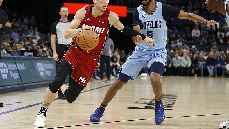Nov 8, 2023; Memphis, Tennessee, USA; Miami Heat guard Tyler Herro (14) drives to the basket as Memphis Grizzlies forward Ziaire Williams (8) defends during the first half at FedExForum. Mandatory Credit: Petre Thomas-USA TODAY Sports