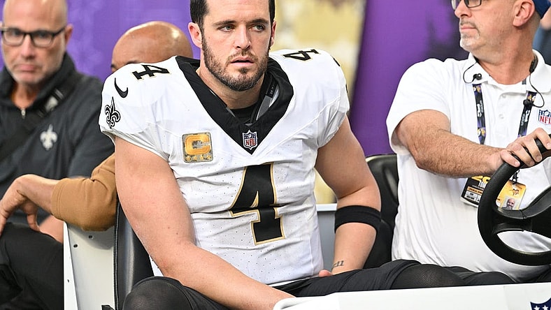 Nov 12, 2023; Minneapolis, Minnesota, USA; New Orleans Saints quarterback Derek Carr (4) is carted off the field after an injury against the Minnesota Vikings during the thrid quarter at U.S. Bank Stadium. Mandatory Credit: Jeffrey Becker-USA TODAY Sports