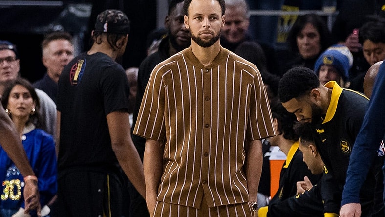 Nov 14, 2023; San Francisco, California, USA; Golden State Warriors guard Stephen Curry (30) watches the game against the Minnesota Timberwolvesx during the first half at Chase Center. Mandatory Credit: John Hefti-USA TODAY Sports