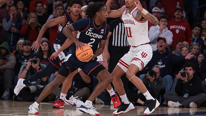 Nov 19, 2023; New York, New York, USA; Connecticut Huskies guard Tristen Newton (2) dribbles as Indiana Hoosiers guard CJ Gunn (11) defends during the second half at Madison Square Garden. Mandatory Credit: Vincent Carchietta-USA TODAY Sports