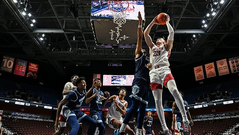 Nov 19, 2023; Uncasville, CT, USA; Washington State Cougars forward Andrej Jakimovski (23) jumps to shoot the ball challenged by Rhode Island Rams guard Zek Montgomery (0) during the second half at Mohegan Sun Arena. Mandatory Credit: Mark Smith-USA TODAY Sports