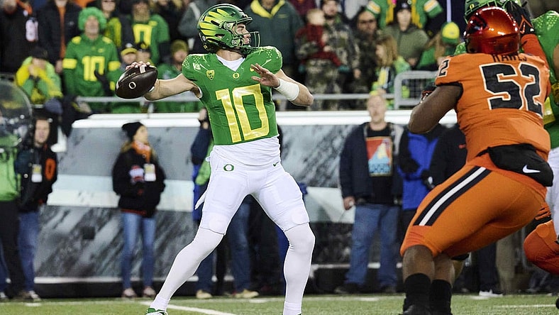 Nov 24, 2023; Eugene, Oregon, USA; Oregon Ducks quarterback Bo Nix (10) throws a pass during the first half against the Oregon State Beavers at Autzen Stadium. Mandatory Credit: Troy Wayrynen-USA TODAY Sports