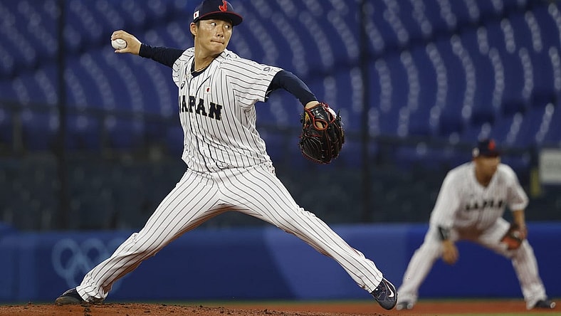 Aug 4, 2021; Yokohama, Japan; Team Japan pitcher Yoshinobu Yamamoto (17) throws a pitch against Korea in a baseball semifinal match during the Tokyo 2020 Olympic Summer Games at Yokohama Baseball Stadium. Mandatory Credit: Yukihito Taguchi-USA TODAY Sports