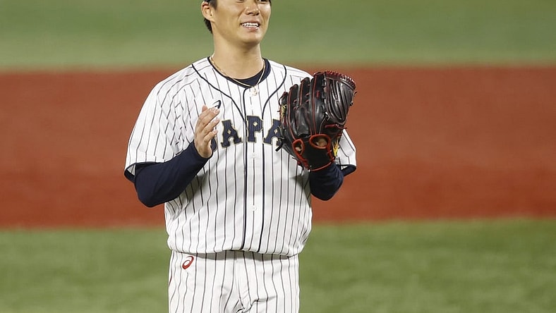 Aug 4, 2021; Yokohama, Japan; Team Japan pitcher Yoshinobu Yamamoto (17) reacts against Korea in a baseball semifinal match during the Tokyo 2020 Olympic Summer Games at Yokohama Baseball Stadium. Mandatory Credit: Yukihito Taguchi-USA TODAY Sports
