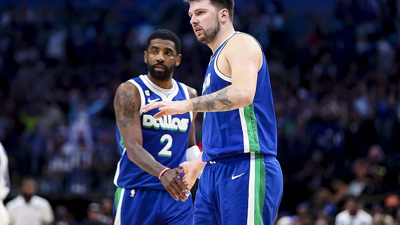 Apr 5, 2023; Dallas, Texas, USA;  Dallas Mavericks guard Luka Doncic (77) and Dallas Mavericks guard Kyrie Irving (2) react during the fourth quarter against the Sacramento Kings at American Airlines Center. Mandatory Credit: Kevin Jairaj-USA TODAY Sports