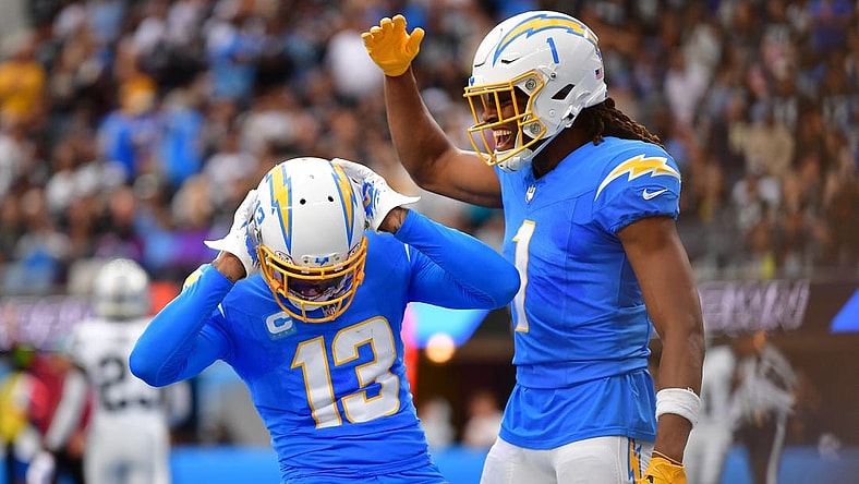Oct 1, 2023; Inglewood, California, USA; Los Angeles Chargers wide receiver Keenan Allen (13) celebrates his touchdown scored against the Las Vegas Raiders with wide receiver Quentin Johnston (1) during the first half at SoFi Stadium. Mandatory Credit: Gary A. Vasquez-USA TODAY Sports