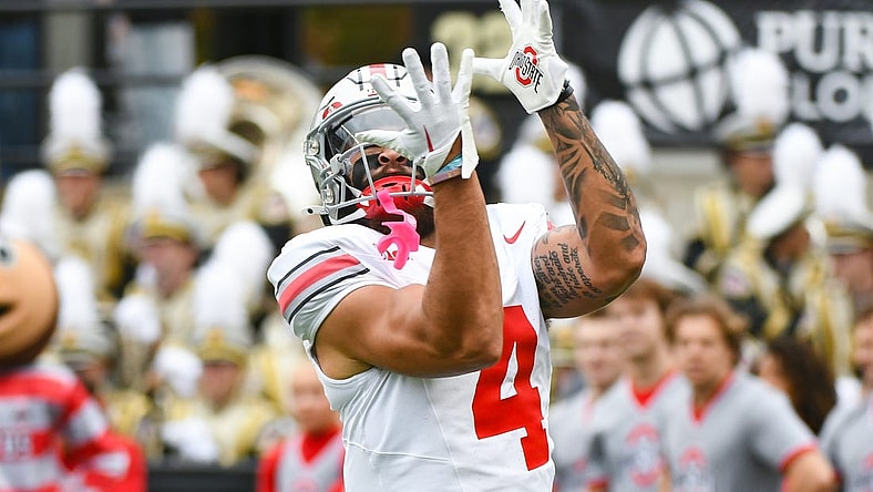 Oct 14, 2023; West Lafayette, Indiana, USA; Ohio State Buckeyes wide receiver Julian Fleming (4) catches a pass during warmups prior to the game at Ross-Ade Stadium. Mandatory Credit: Robert Goddin-USA TODAY Sports
