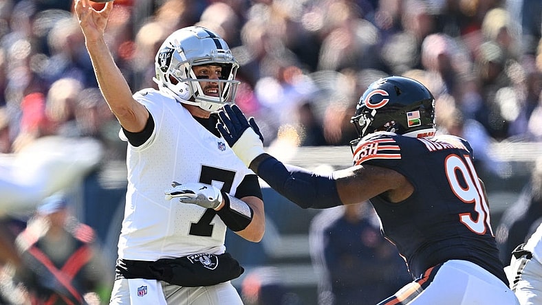 Oct 22, 2023; Chicago, Illinois, USA;  Las Vegas Raiders quarterback Brian Hoyer (7) gets off a pass while being pressured by Chicago Bears defensive lineman Yannick Ngakoue (91) in the second quarter at Soldier Field. Mandatory Credit: Jamie Sabau-USA TODAY Sports