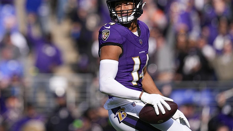 Nov 12, 2023; Baltimore, Maryland, USA; Baltimore Ravens safety Kyle Hamilton (14) celebrates after scoring a touchdown against the Cleveland Browns during the first quarter at M&T Bank Stadium. Mandatory Credit: Jessica Rapfogel-USA TODAY Sports