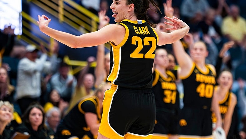 Iowa Hawkeyes guard Caitlin Clark (22) celebrates a three point basket during the third quarter of the Gulf Coast Showcase championship game against the Kansas State Wildcats at Hertz Arena in Estero on Sunday, Nov. 26, 2023.