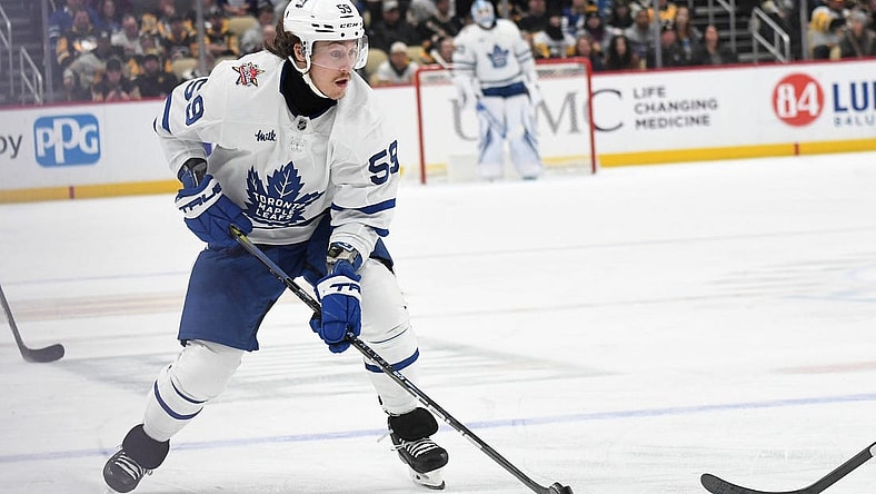 Nov 25, 2023; Pittsburgh, Pennsylvania, USA; Toronto Maple Leafs left wing Tyler Bertuzzi (59) moves the puck against the Pittsburgh Penguins during the second period at PPG Paints Arena. Mandatory Credit: Philip G. Pavely-USA TODAY Sports