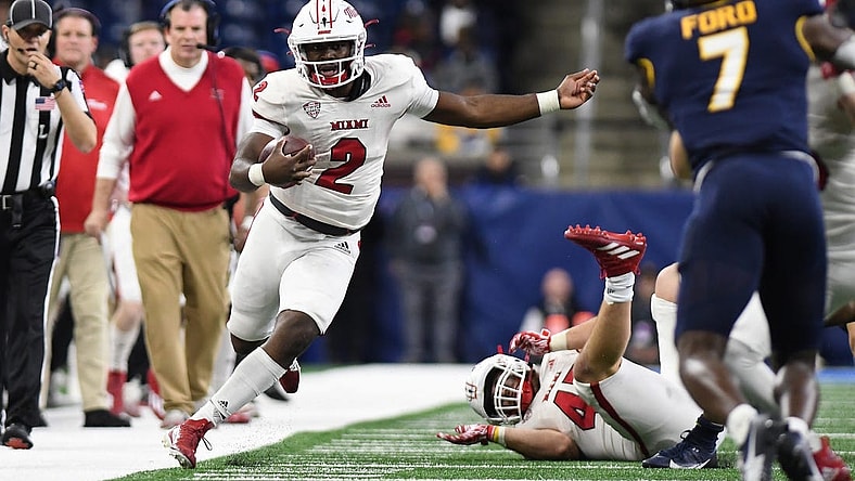 Dec 2, 2023; Detroit, MI, USA; Miami (OH) Redhawks quarterback Aveon Smith (2) runs up the sidelines against the Toledo Rockets in the third quarter at Ford Field. Mandatory Credit: Lon Horwedel-USA TODAY Sports