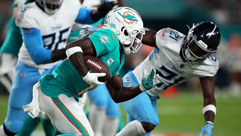 Dec 11, 2023; Miami Gardens, Florida, USA; Miami Dolphins wide receiver Tyreek Hill (10) runs with the ball against the Tennessee Titans during the first half at Hard Rock Stadium. Mandatory Credit: Jasen Vinlove-USA TODAY Sports