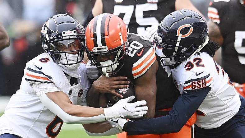 Dec 17, 2023; Cleveland, Ohio, USA; Chicago Bears cornerback Kyler Gordon (6) and cornerback Terell Smith (32) tackle Cleveland Browns running back Pierre Strong Jr. (20) during the first quarter at Cleveland Browns Stadium. Mandatory Credit: Ken Blaze-USA TODAY Sports