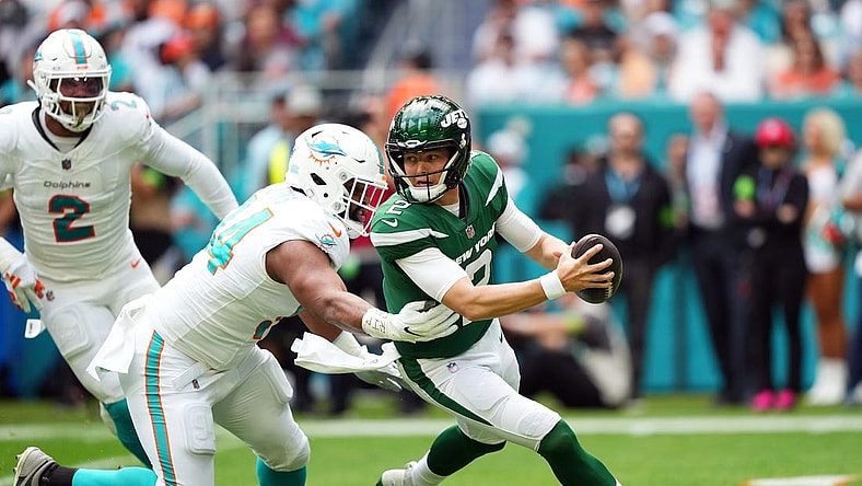 Dec 17, 2023; Miami Gardens, Florida, USA; Miami Dolphins defensive tackle Christian Wilkins (94) rushes in on New York Jets quarterback Zach Wilson (2) during the first half at Hard Rock Stadium. Mandatory Credit: Jasen Vinlove-USA TODAY Sports